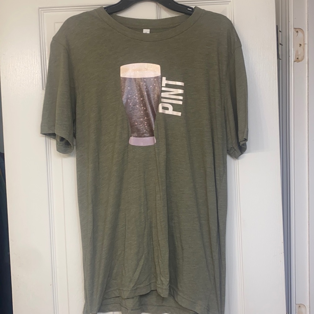 Pint T-shirt with Guinness Pint graphics on front. Sz L, Color military green.